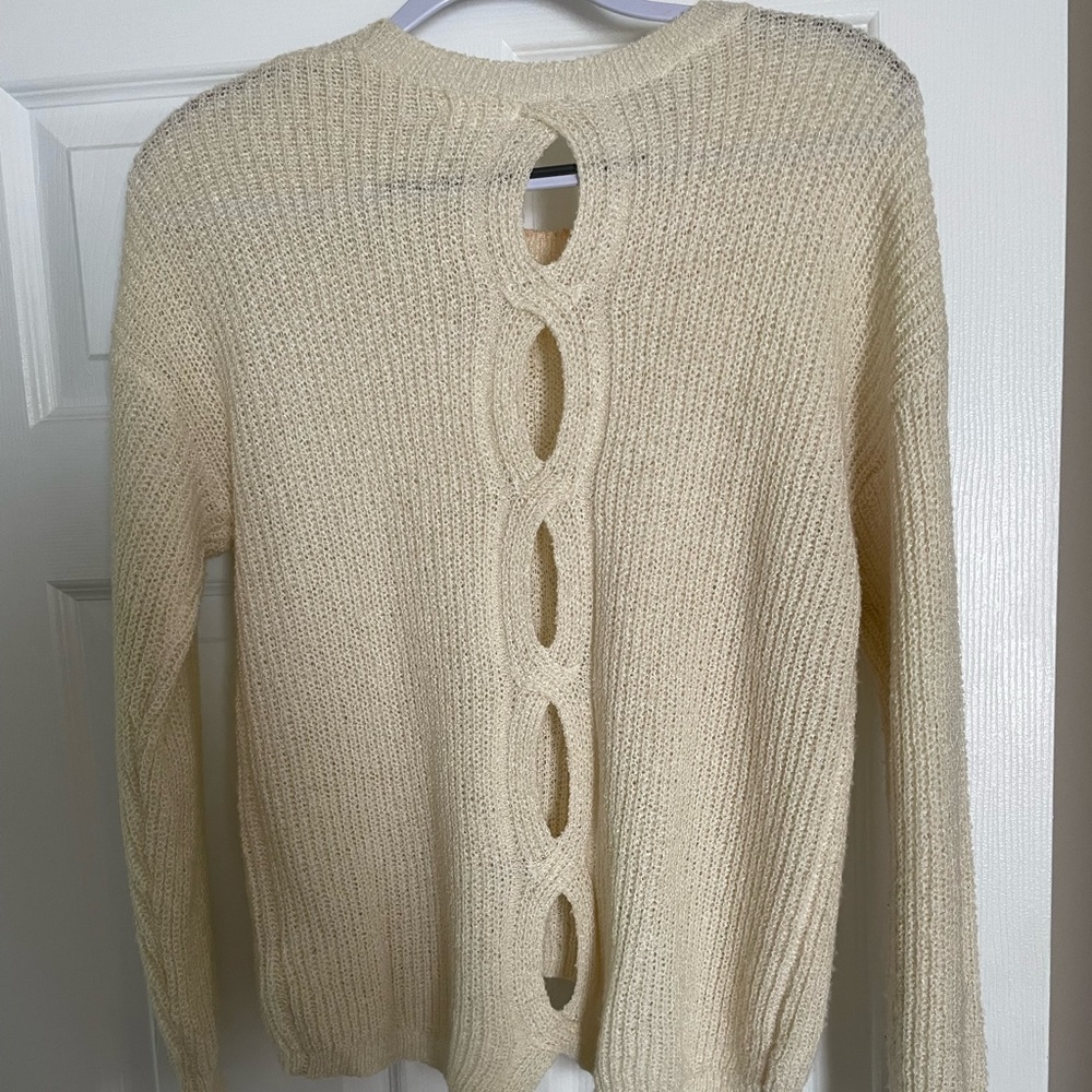 Lightweight sweater with back details.